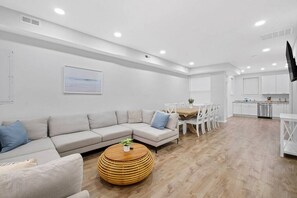 Step into the captivating open-concept interior, where the grandeur and seamless design instantly inspire a sense of awe and amazement.