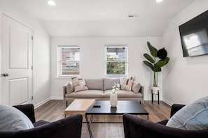 Living area with 55” Smart TV to log-in to your favorite steaming service.