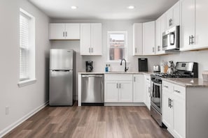 Kitchen has all the equipment you need for home cooking including coffee.