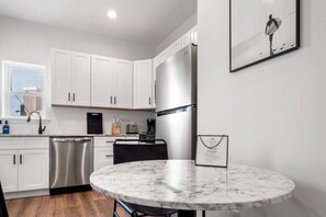 This stunning kitchen is perfect for entertaining guests or enjoying a quiet meal at home.