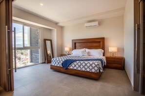 The bedroom features a king size bed and nice view