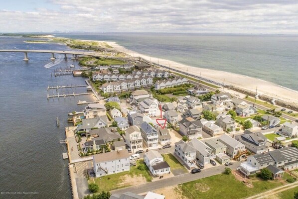 Drone photo of the home right between the ocean and river 