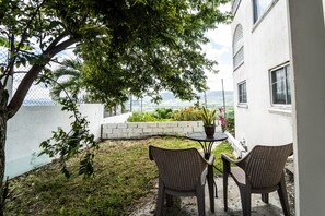 "Chair","Furniture","Patio","Flagstone","Tree"