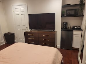 tv, dresser, mini fridge, microwave & coffee maker