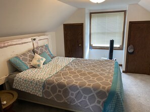 Upstairs bedroom with queen bed. 