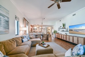 Oversize Sectional sofa and  65" TV makes this living room a great space