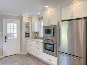 Another view of the kitchen with plenty of storage.