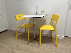 Table for dining and dedicated workspace for two.