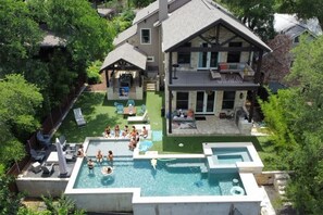 Plenty of room to bask in the sun, relax in the shade, and wade the water in private pool/hot tub. Enjoy the Downtown Austin city skylight by the gas fire pit area