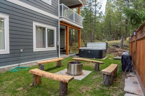 Private backyard with fire pit & hot tub.