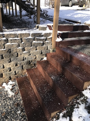 Stairs from the parking area heading towards the front door.