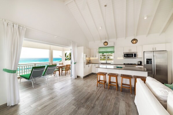 Open area showing kitchen and patio
