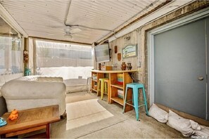 Partially enclosed outdoor deck (under the deck) 