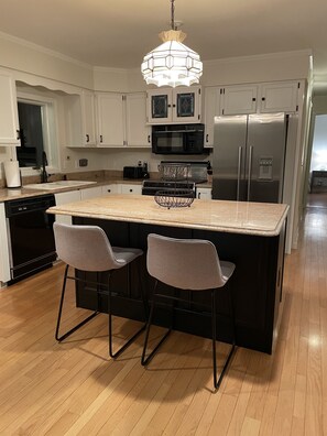 Kitchen with island, will have updated appliances soon!