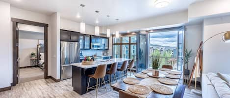 Luxury kitchen and dining area with open air doors to enjoy the mountain air