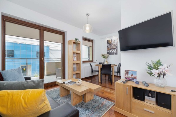 Living room with a comfortable sofa and TV. 