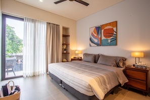 The master bedroom features a king size bed, ensuite bathroom, walk-in closet and a private balcony