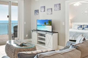 Living Room with queen sleeper sofa & private balcony!