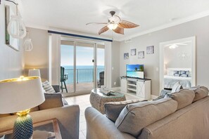 Living Room with queen sleeper sofa & private balcony!