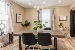 Stunning dining room with a chic bar cart for mixing up your favorite drinks. 