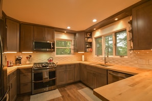 Open Kitchen with butcher block counter tops.