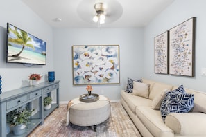 Whether it's a movie night with loved ones or simply lounging and enjoying each other's company, our palm-themed living area is the perfect gathering spot for quality time and making cherished memories.