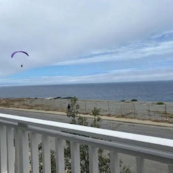 Paragliding, seen from the porch, is a popular sport here.
