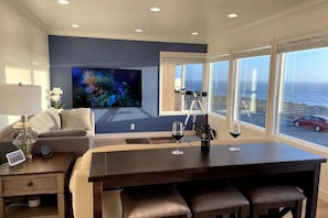 Living room with lots of windows facing the ocean