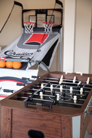Game room located in the garage. Pop-a-Shot and foosball
