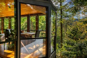 With floor to ceiling windows, you can enjoy nature throughout the cabin