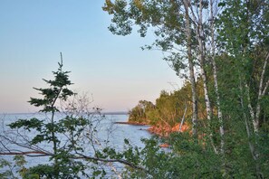 From the edge of the property, you'll get a spectacular view of the red sandstone cliffs at the tip of Bark Point.