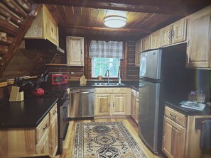 Recently updated and fully stocked kitchen for enjoying home cooked meals.