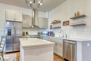 Open concept kitchen with stainless steel appliances