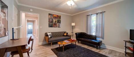 Comfortable living room with MId-Century Modern furniture, TV, and record player