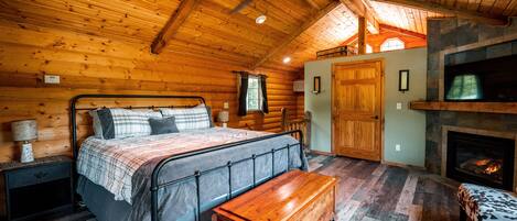 Master bedroom suite with jacuzzi and fireplace