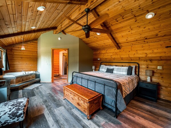 Master bedroom suite with jacuzzi and fireplace