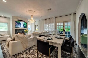Step into this beautiful unit, where the living room seamlessly flows into a sleek and sophisticated dining area, creating an inviting and stylish space.