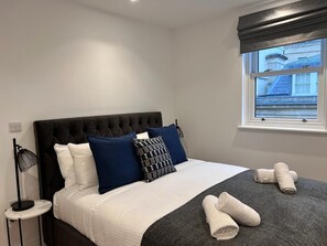 Bedroom with king bed and build in wardrobe 