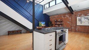 The kitchen and living room areas flow seamlessly together in this open floor concept.