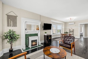 Admire the original fireplace design from the columns to the tile. Functional and beautiful!