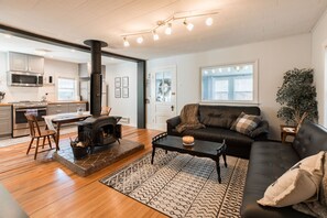 The living area has an open floor plan leading into the kitchen 