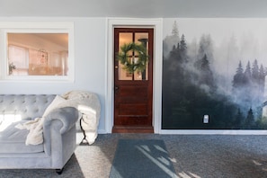 The entryway into the main living area - has an instagrammable wallpaper