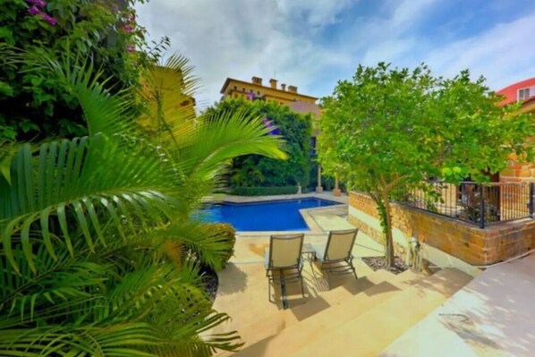 Relax in comfort around the pool with both sunny and shaded areas!