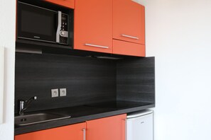 Prepare a meal in the equipped kitchen.