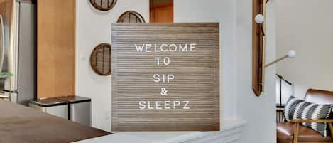 Front entryway of Sip N Sleepz showcasing a wall hook to hang hats, coats, etc.