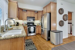 Kitchen featuring stainless steel appliances and all the kitchenware to enjoy a meal