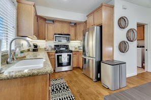 Kitchen featuring stainless steel appliances and all the kitchenware to enjoy a meal