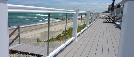 Relax on a wrap-around deck or walk onto the beach.