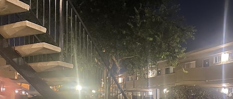 Night time Patio View. Well illuminated with a refined landscape. 