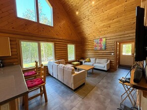 Step inside Blazed Inn, where the warmth of log walls and the luxury of radiant heated floors create a cozy retreat on 20 acres of beautiful forest near the National Park.